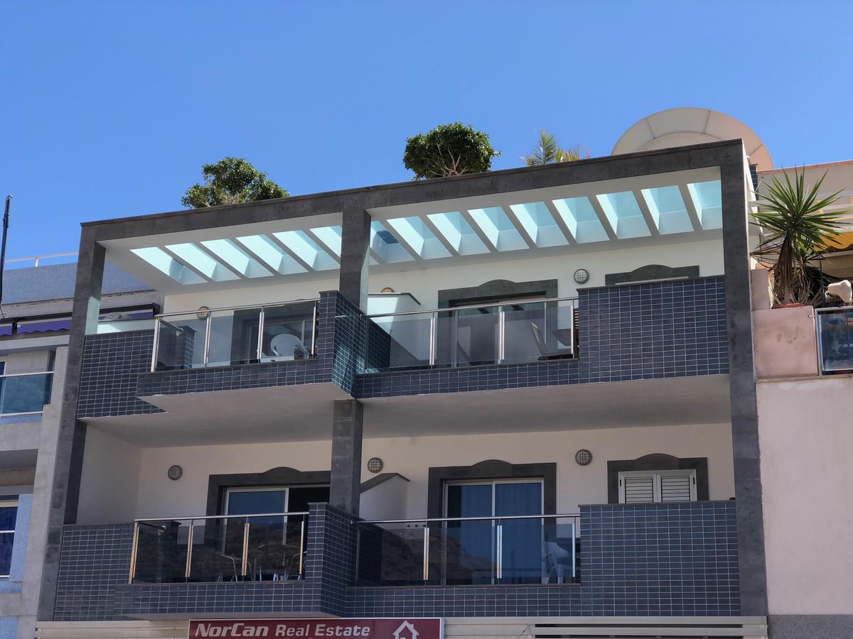 פוארטו דה מוגן Billy'S Beachfront Apartment With Pool Access מראה חיצוני תמונה
